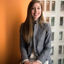 Portrait of a professional woman in business attire — Metrion client community.