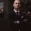 Portrait of a business professional in a suit — Metrion client community.