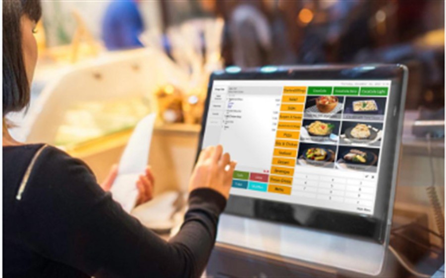 Restaurant POS interface in use on a touchscreen for live menu and order management.